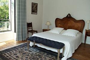 Double bed with antique bedhead