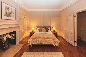 Double room with hardwood floors