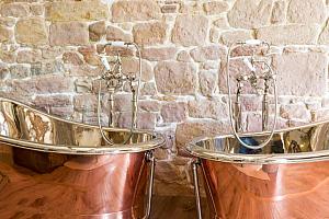 5 Star hotel room with twin copper baths