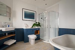 Large bathroom with bath and shower