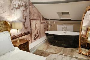 Free-standing bath in room