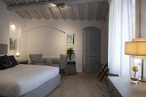 Double bedroom with easy chairs