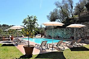 Pool terrace with sunbeds and shades