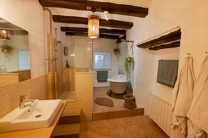 Bathroom with shower and rolltop bath