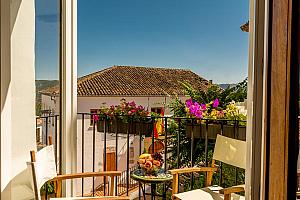 Bedroom with balcony and view