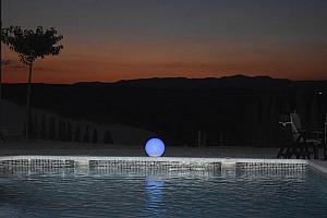 Swimming pool lit at night