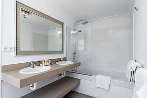 En-suite bathroom with bath and shower