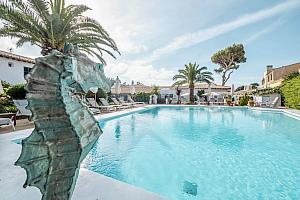 hotel pool with seahorse statue